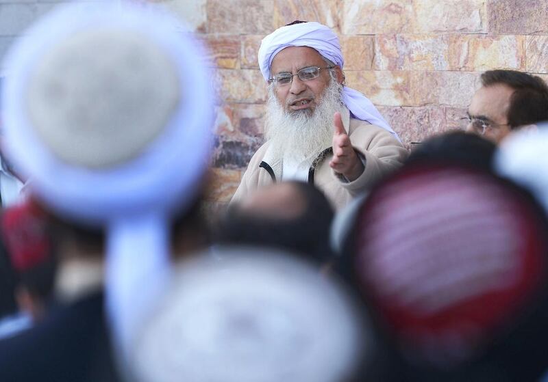 Chief cleric of Islamabad's Red Mosque, Maulana Abdul Aziz, talks to the media during a news conference on March 26, 2013. Aamir Qureshi/AFP Photo