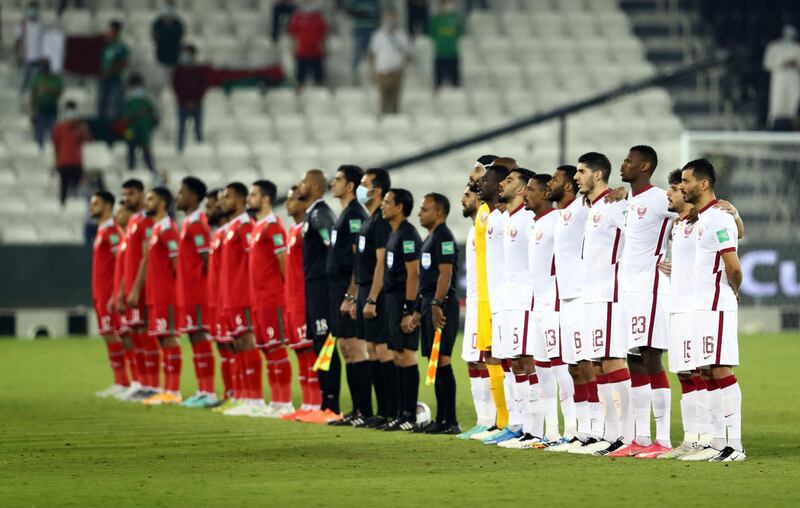 Players and match officials line up before the World Cup qualifying match between Omar and Qatar, in Doha, on June 7, 2021. All photos: Reuters