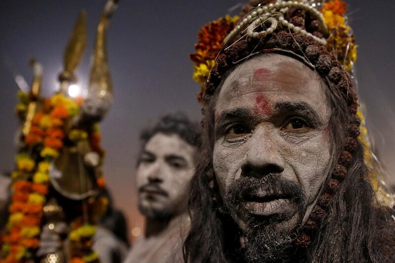 Naga Sadhus or Hindu Holy men leave after taking a dip during the first 'Shahi Snan' (grand bath) at 'Kumbh Mela' or the Pitcher Festival, in Prayagraj, previously known as Allahabad, India. REUTERS
