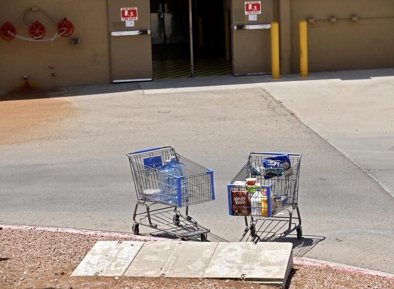 Shopping carts sit next to a curb after a shooting at a Walmart in El Paso, Texas, USA. EPA
