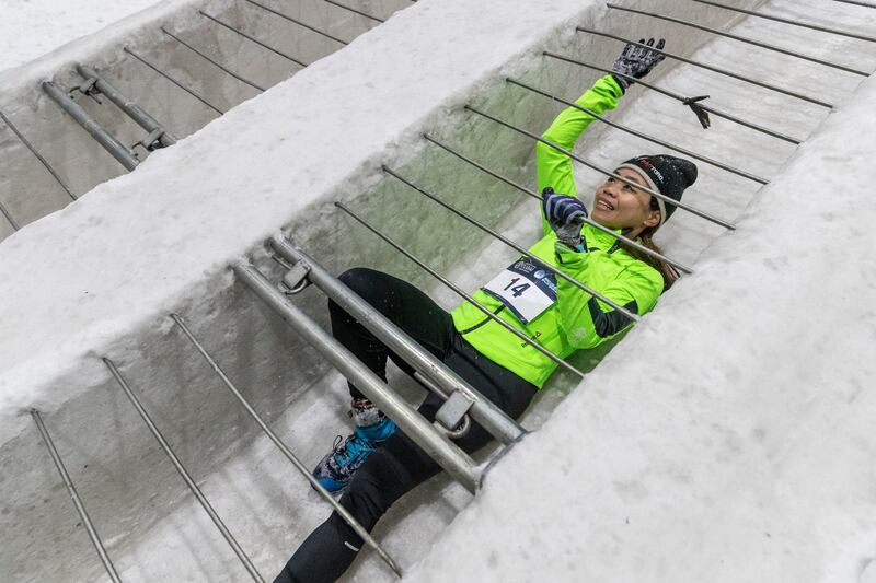 Participants pulled themselves along the snow.
