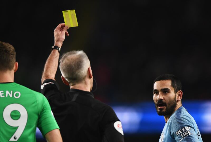 Ilkay Gundogan of Manchester City reacts as he is shown a yellow card by referee Martin Atkinson. Getty Images