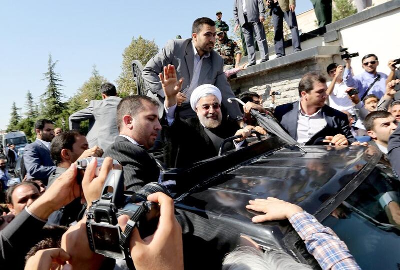 Iranian president Hassan Rouhani arrives at Tehran’s Mehrabad Airport on Saturday. Some 60 hardline Islamists chanted “Death to America” and “Death to Israel” but they were outnumbered by 200 to 300 supporters of the president who shouted: “Thank you Rouhani.” Atta Kenare / AFP   