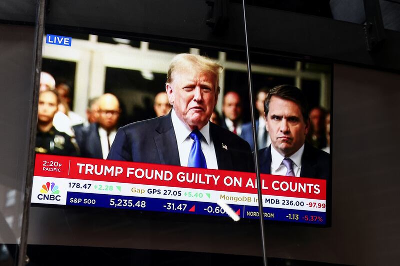 A television screen shows the news of the verdict in Trump's criminal trial. Reuters