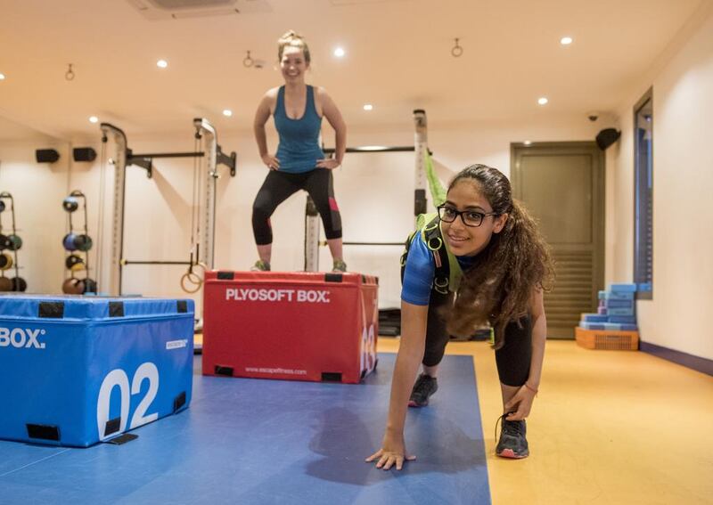 Samiha Hamze, front, and Kristin Mcgrath at The Club’s Studio Two gym for teenagers in Abu Dhabi. Vidhyaa for The National 