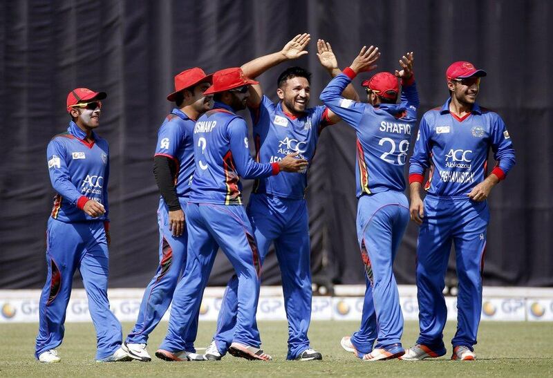 Afghanistan will swap their limited-overs kit for Test ones when they face Zimbabwe at Sharjah this year. Altaf Qadri / AP Photo