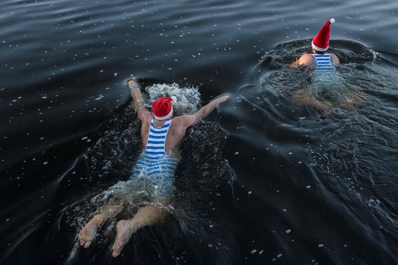Winter swimmers take part in the traditional Christmas swimming event in the Vltava river in Prague. AFP