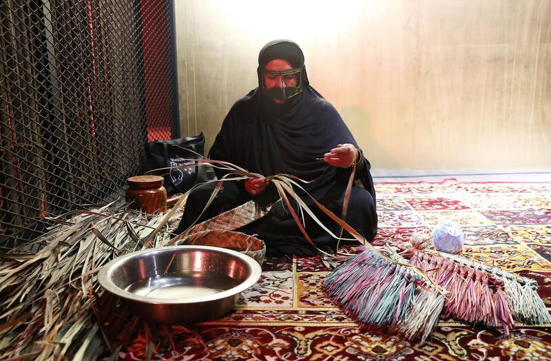 DUBAI, UNITED ARAB EMIRATES, Jan 09  – 2020 :- One of the lady making broom with palm leaves during the Al Shindagha Days culture festival held at Al Shindagha Heritage District in Dubai. (Pawan Singh / The National) Photo essay for Weekend. Story by Katy Gillett 