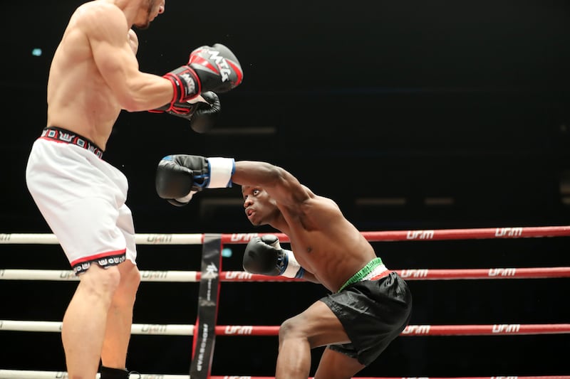 Kagimu (blue gloves) takes on Aminov (red gloves) at the Social Knockout at the Coca-Cola Arena in Dubai.