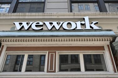 SoftBank is adding $1.1bn to its WeWork commitment . AFP
