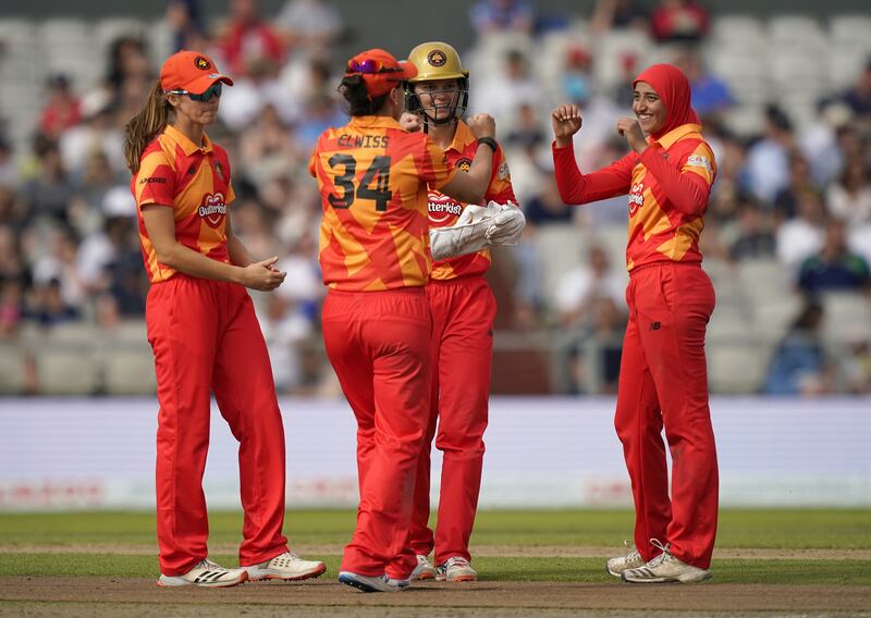 Birmingham Phoenix's Abtaha Maqsood celebrates with team-mates after taking the wicket of Manchester Originals' Eleanor Threlkeld.