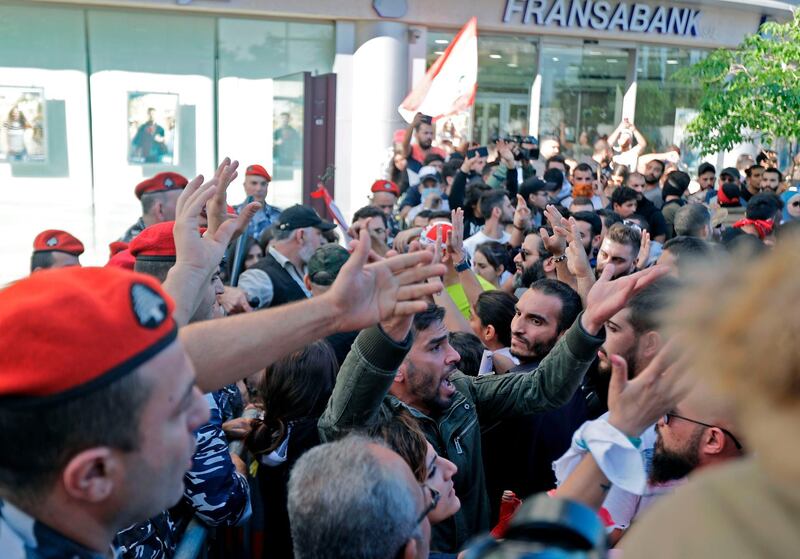 Lebanese protesters trying to reach the parliament in Beirut scuffle with security forces. AFP