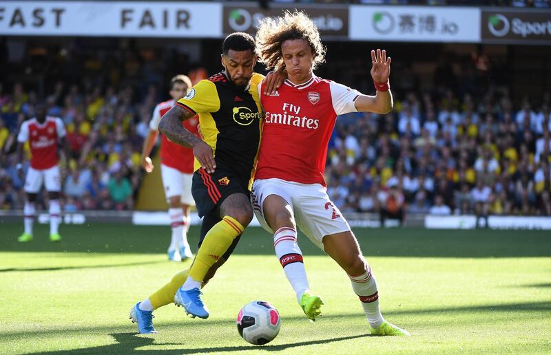 Arsenal's David Luiz, right, vies for the ball with Watford's Andre Gray during an English Premier League match at Vicarage Road. The match ended 2-2 after Arsenal threw away a two-goal advantage. EPA