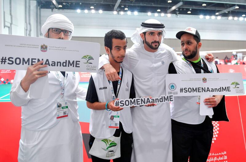 Sheikh Hamdan poses with volunteers at the Special Olympic Mena Games on Monday. Wam