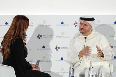 Anwar Gargash speaks on stage with Mina Al-Oraibi, editor-in-chief of The National. Victor Besa / The National