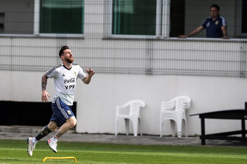 Messi sprints during training. EPA