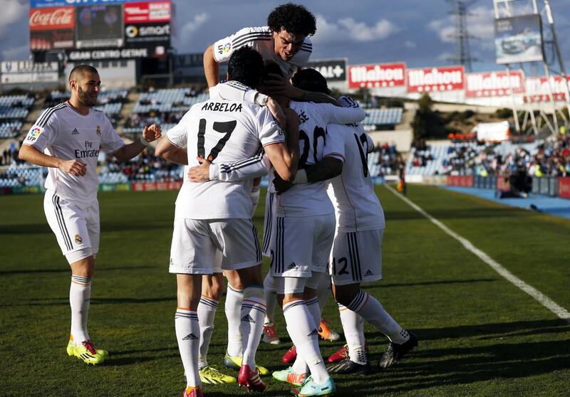 Real Madrid celebrate scoring against Getafe. Reuters