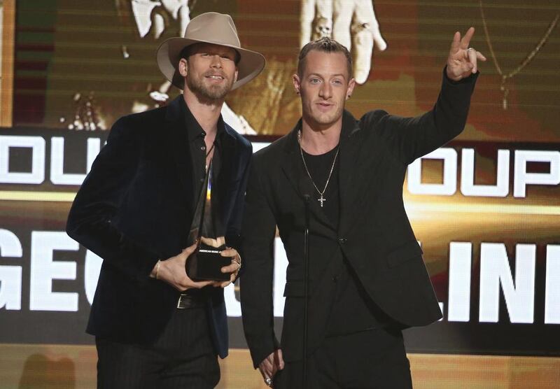 Brian Kelley, left, and Tyler Hubbard, of Florida Georgia Line, accept the award for favorite country duo/group at the American Music Awards at the Microsoft Theater on Sunday, Nov. 20, 2016, in Los Angeles. (Photo by Matt Sayles/Invision/AP)