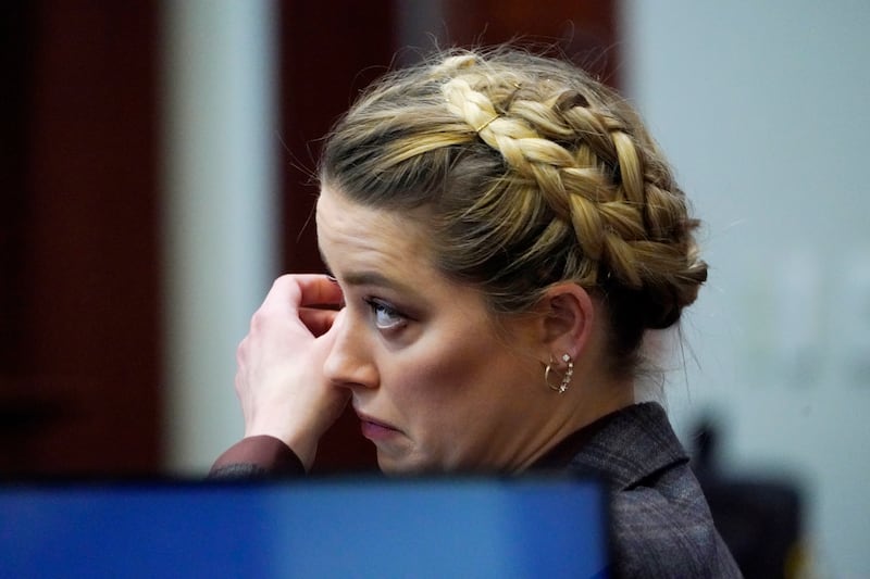 Actor Amber Heard listens in the courtroom at the Fairfax County Circuit Court in Fairfax, Virginia. AP