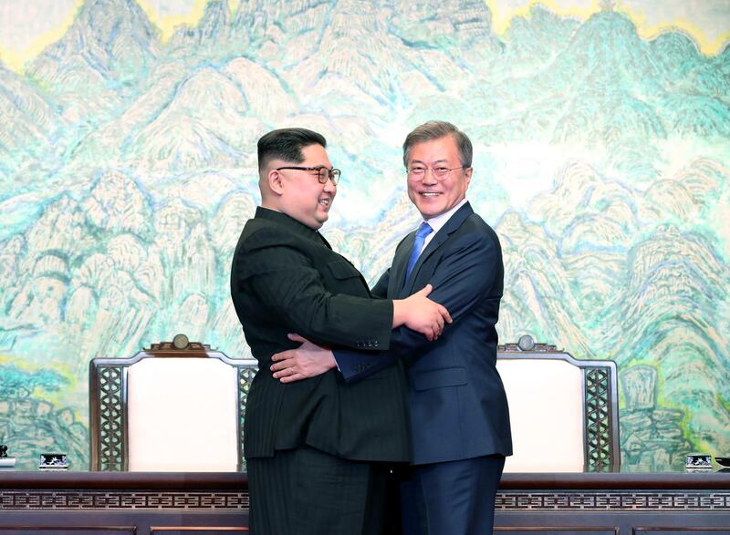 North Korean leader Kim Jong-un, left, and South Korean president Moon Jae-in embrace after signing the Panmunjom Declaration for Peace, Prosperity and Unification of the Korean Peninsula. orea Summit Press Pool / Getty Images
