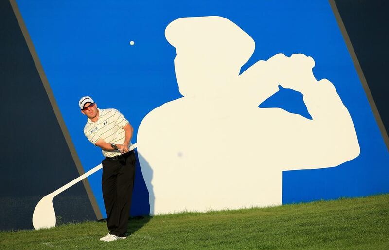 Richie Ramsay of Scotland plays his third shot at the par 5, 18th hole during the third round of the DP World Tour Championship at the Jumeirah Golf Estates. David Cannon / Getty Images