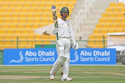 Zimbabwe captain Sean Williams salutes his teammates after reaching 50. Courtesy Abu Dhabi Cricket