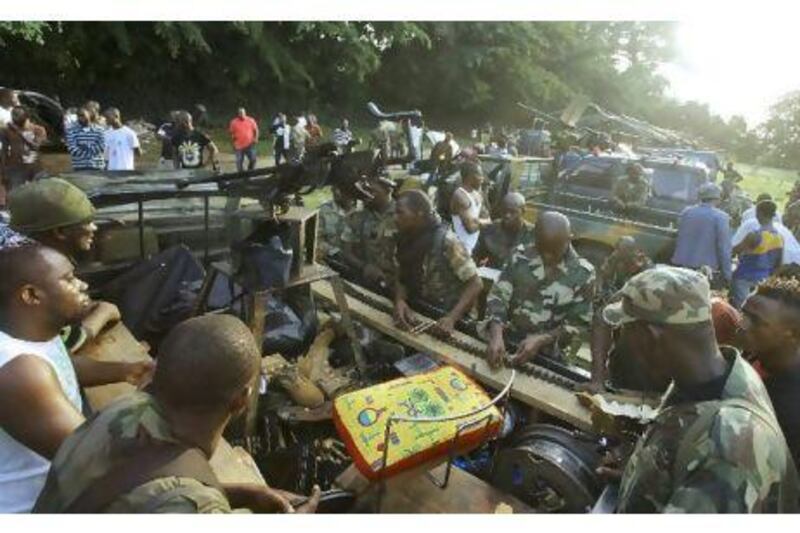 Forces loyal to Alassane Ouattara prepare for a battle in Abidjan.