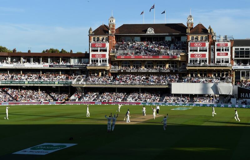 Enghland players celebrate after Stuart Broad takes the wicket of Pat Cummins. Getty