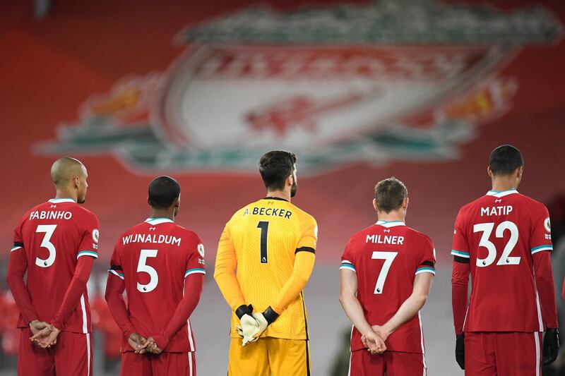 Liverpool players stand for a minute's silence in memory of former goalkeeper Ray Clemence, who died on November 15. AP,