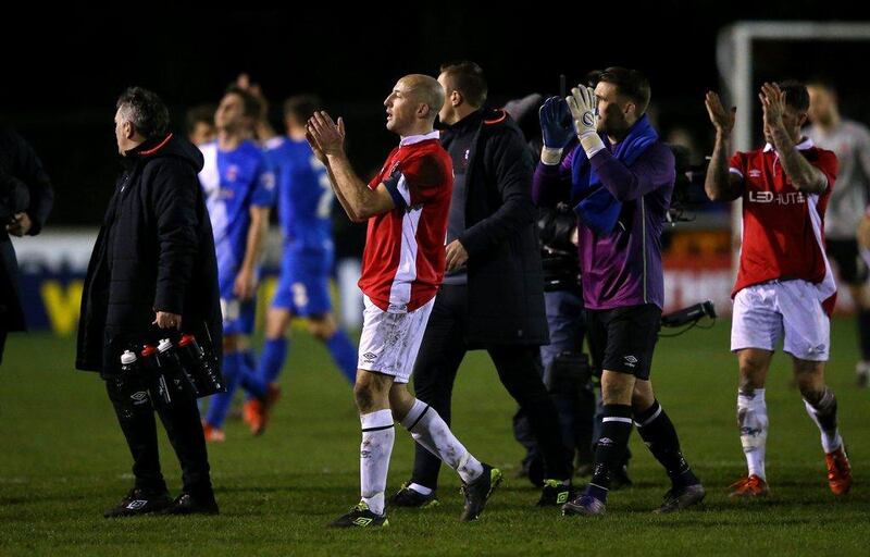 Chris Lynch, centre, of Salford City applauds the fans with his teammates following the FA Cup second round match against Hartlepool on Friday night. Alex Livesey / Getty Images / December 4, 2015