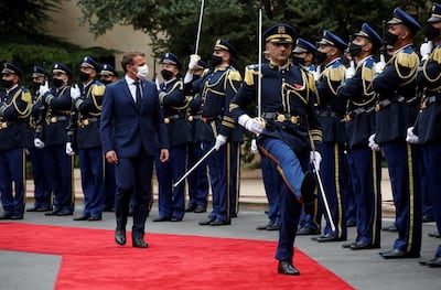 epa08639147 French President Emmanuel Macron wears a face mask as inspects an honor guard to attend a meeting with Lebanon's President Michel Aoun at the presidential palace in Baabda, Lebanon, 01 September 2020. Macron is in Lebanon to mark the the former French protectorate's 100th anniversary. It is the French president's second visit within one month when he visited the country following the 04 August Beirut port blast in which at least 190 people died and 6,500 were injured and large parts of the port and the city were devastated.  EPA/GONZALO FUENTES / POOL  MAXPPP OUT
