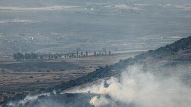 Smoke rises from fires in the hills after rockets launched from southern Lebanon landed on the Banias area in the Israel-annexed Golan Heights on June 21, 2024, amid ongoing cross-border clashes between Israeli troops and Hezbollah fighters.  (Photo by Jalaa MAREY  /  AFP)