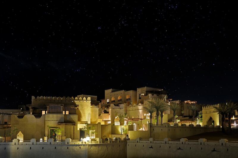 Qasr Al Sarab Desert Resort by Anantara, at night. Anantara