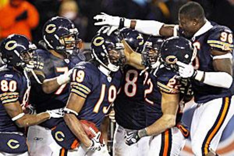 Teammates congratulate Devin Aromashodu, No 19, after his winning touchdown for the Bears.