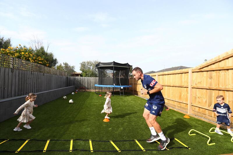 MELBOURNE, AUSTRALIA - APRIL 23: Melbourne Victory A-League Player Leigh Broxham training in isolation with his children, triplets Billie, Sonny and Mila on April 23, 2020 in Melbourne, Australia. A-League players across the country are now training in isolation under strict policies in place due to the Covid-19 pandemic. (Photo by Robert Cianflone/Getty Images)