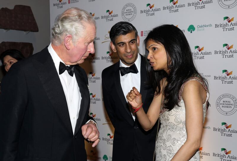 Mr Sunak and Ms Murthy speak to then-Prince Charles at a British Asian Trust event in February 2022. Getty Images