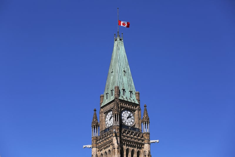 A Canadian flag flies at half-staff at the top of the Peace Tower after the death of Britian's Queen Elizabeth II on September 8, 2022 in Ottawa. AFP