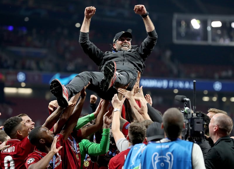 Klopp is lifted up by his players after the win over Tottenham. PA Photo