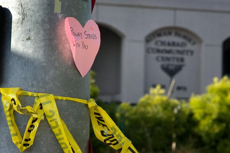 Paper hearts with messages of support are visible at an intersection next to the Chabad of Poway synagogue in Poway, California, 27 April 2019. EPA