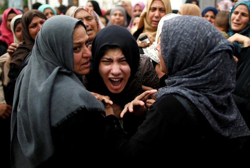 A relative of Palestinian gunman Naji al-Zaneen, who was killed in an Israeli air strike, reacts during his funeral in the northern Gaza Strip. Reuters