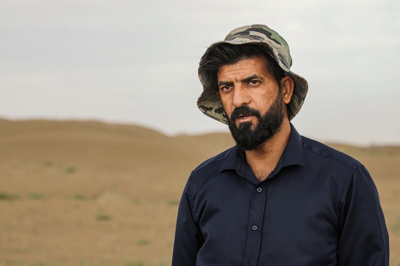 Archaeologist Aqeel Mansarawi at the ancient site in the southern Dhi Qar province, which he says is now under threat from sandstorms linked to climate change