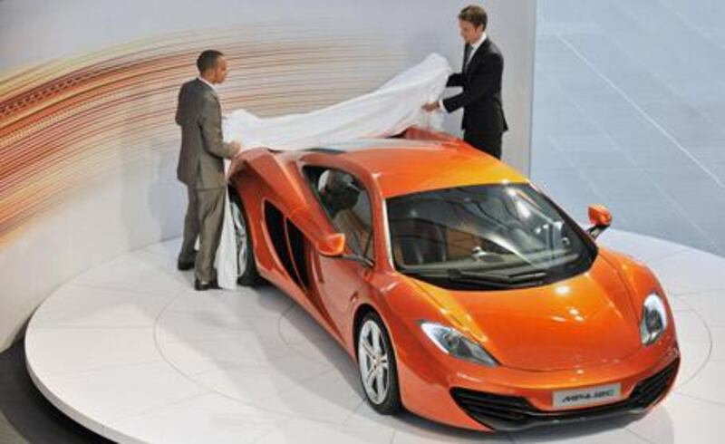 Not only have Lewis Hamilton (left) and Jenson Button helped develop the MP4-12C, they also each have plans to buy one.