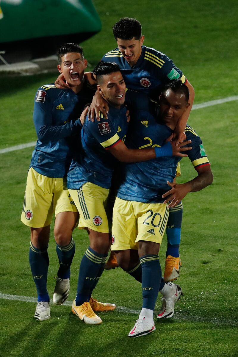 Coombia players celebrate Falcao's goal. AP