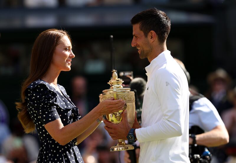 The Duchess of Cambridge hands over the trophy to Wimbledon winner Novak Djokovic at the All England Club. Getty