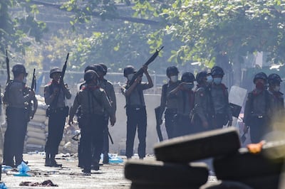 (20/31) (FILE) - Police officers search for demonstrators hiding during a protest in Yangon, Myanmar, 08 March 2021 (reissued 27 January 2022).  On 01 February 2021 the Myanmar Army arrested democratically elected political leaders and seized control of the country.  Protests erupted nationwide leading to violent clashes and a military retaliation that had left at least 1,000 dead within the first six months.  According to the United Nations, by early December 2021 over 280,000 people were still internally displaced in Myanmar due to armed clashes and insecurity.   EPA / STRINGER  ATTENTION: This Image is part of a PHOTO SET