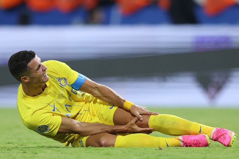 Cristiano Ronaldo clutches his knee after going down from a challenge during Al Nassr's King Salman Club Cup final victory against Al Hilal. Getty