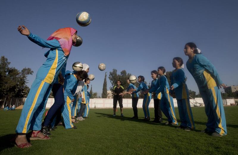 Palestinian girls tarining at the Beit Lahia football club in the northern Gaza strip as part of an after-school sport program funded by the Palestine Association for Children’s Encouragement of Sports. Mahmud Hams / AFP  