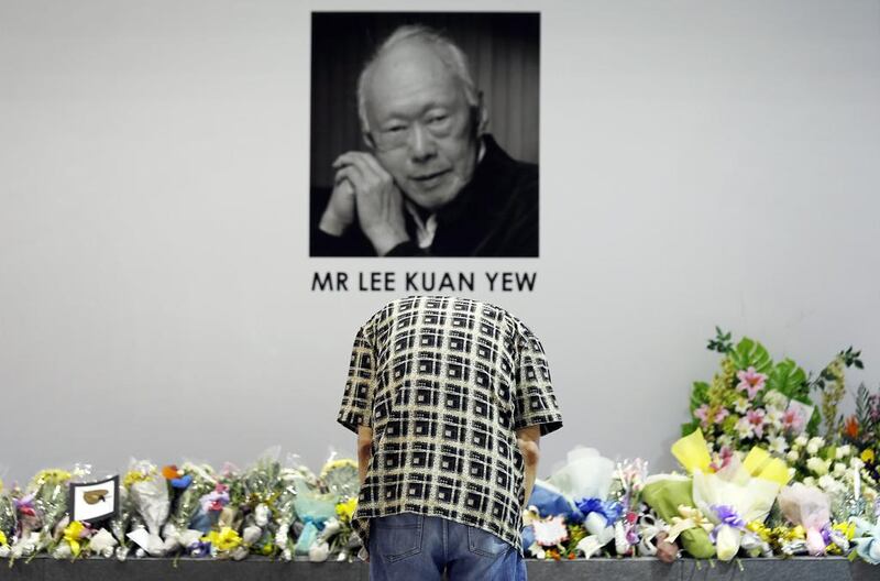 A man bows to pay his respects to the late Lee Kuan Yew, former prime minister of Singapore, at a community club where members of the public can gather to express their condolences on March 23, 2015 as the seven-day national mourning period began. Wong Maye-E/AP Photo