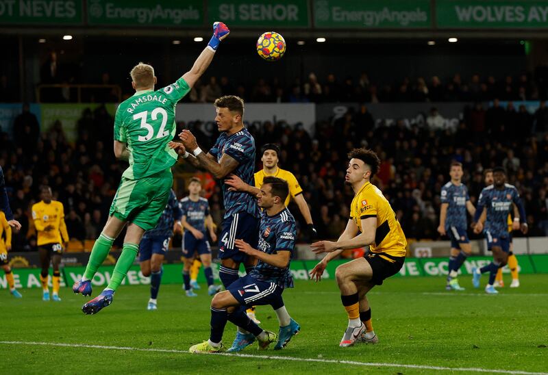 Arsenal goalkeeper Aaron Ramsdale punches clear. Reuters