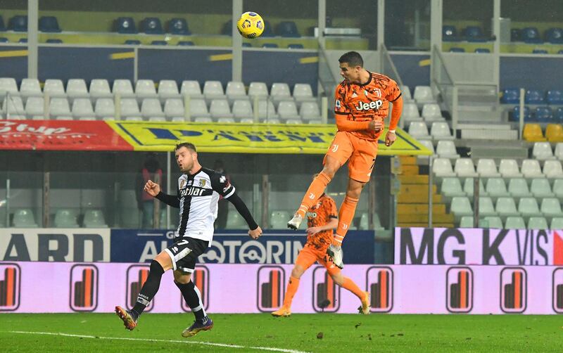 PARMA, ITALY - DECEMBER 19:  Cristiano Ronaldo of Juventus F.C.  scores their team's second goal during the Serie A match between Parma Calcio and Juventus at Stadio Ennio Tardini on December 19, 2020 in Parma, Italy. Sporting stadiums around Italy  remain under strict restrictions due to the Coronavirus Pandemic as Government social distancing laws prohibit fans inside venues resulting in games being played behind closed doors. (Photo by Alessandro Sabattini/Getty Images)